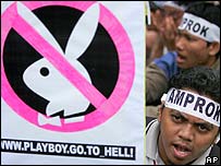 A Muslim protester displays a defaced Playboy logo during an anti-pornography rally in Jakarta